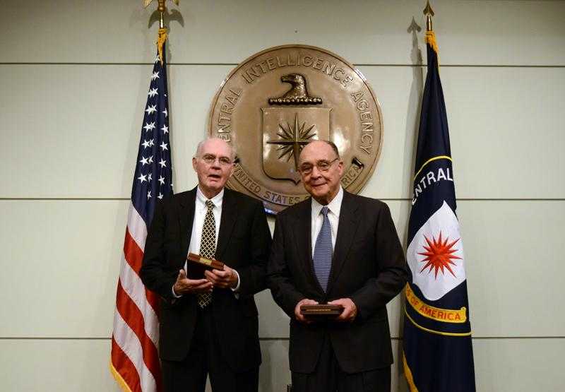 Photo of Downey and Fecteau receiving the Distinguished Intelligence Cross at CIA Headquarters in 2013.