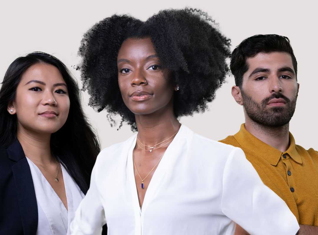 A group of three professionals in front of a tan background.