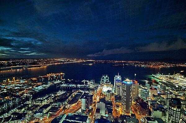 The city of Auckland, the largest in New Zealand, is home to almost a third of the country's population. This is a view of the North Island city at night as seen from its tallest tower.