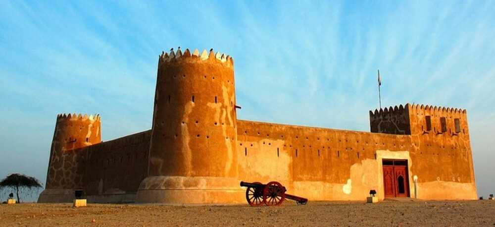 Al Zubarah Fort is part of the Al Zubarah Archaeological Site on the northwestern coast of Qatar, about 105 km (65 mi) north of the capital of Doha. The site was a pearling and trading center in the 18th and 19th centuries, and the name is derived from the Arabic word for “sand mounds.” Built in 1938, the fort served as a Qatari Coast Guard station before being converted to a museum for archaeological finds from the site.