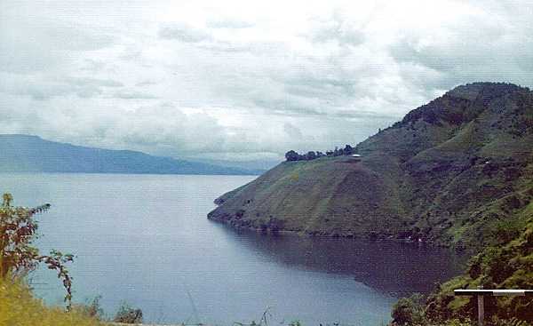 Located in the Barisan Mountains in north-central Sumatra, Indonesia, Lake Toba is the largest lake in the country and the largest volcanic crater lake in the world. It covers an area of 1,140 sq km (440 sq mi) and is 450 m (1,476 ft) deep. Lake Toba became a UNESCO geopark in 2020.