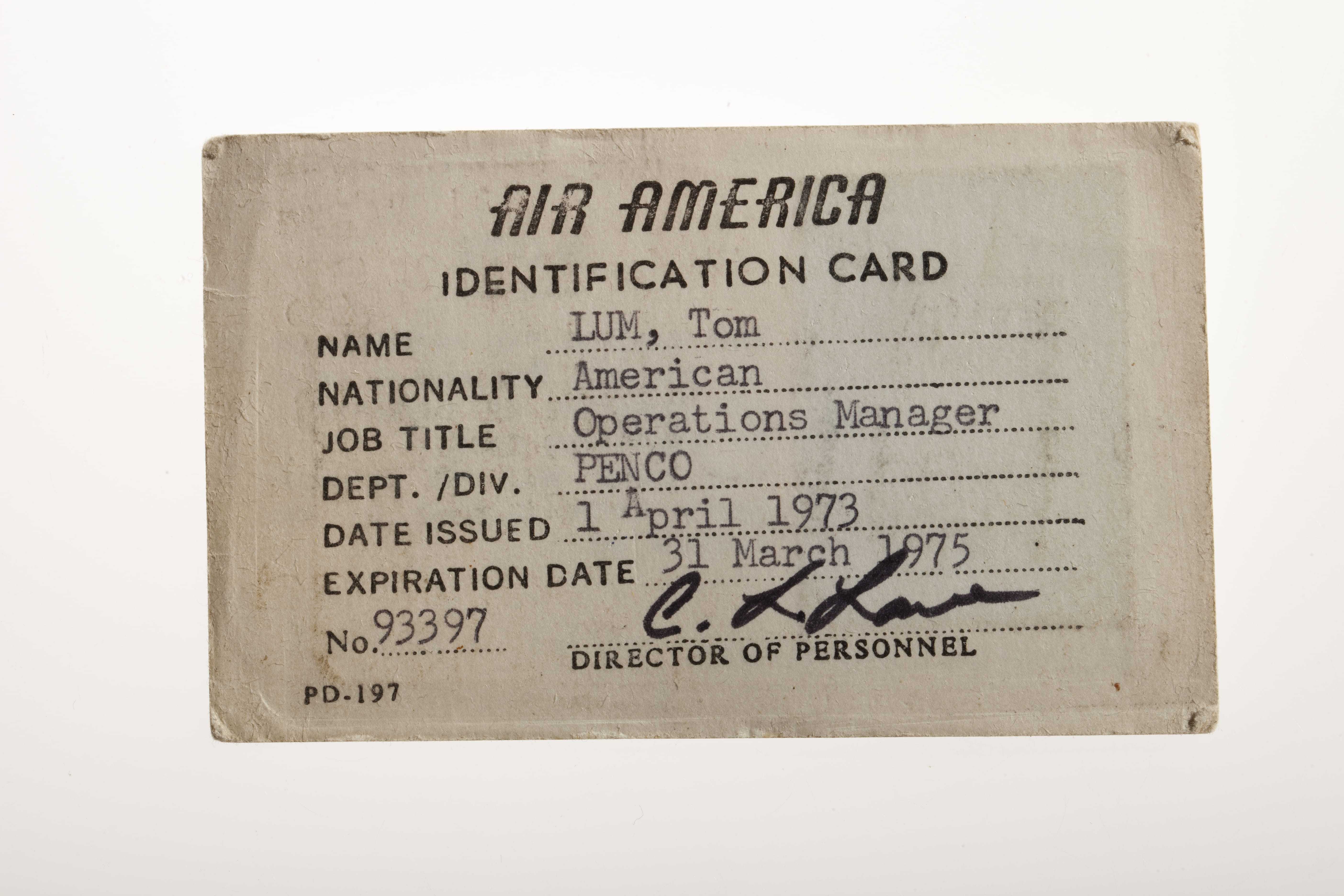 Identification card for Air America with personal details of Tom Lum filled in.