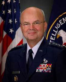 General Michael V. Hayden in front of the American and CIA flags.