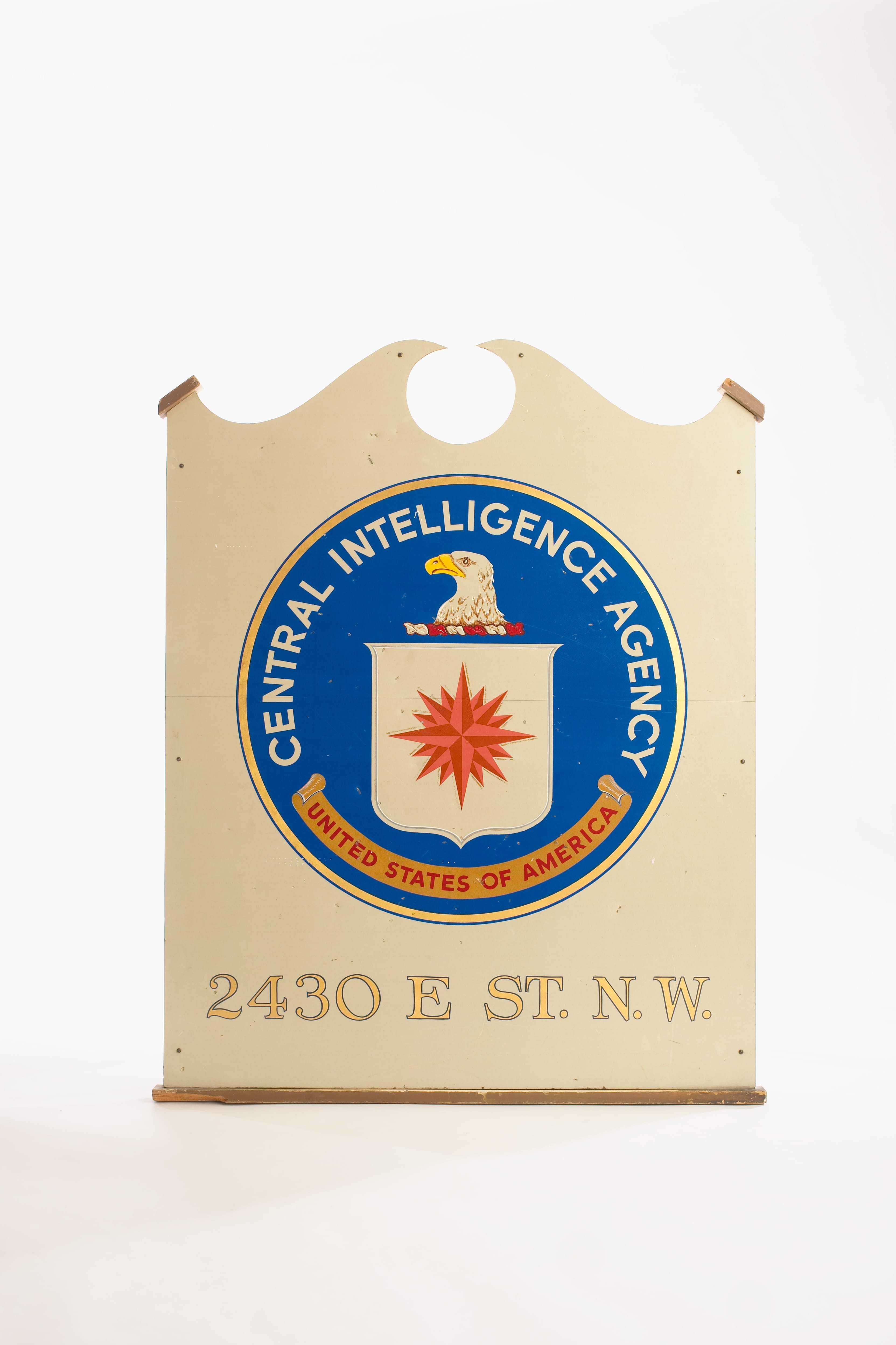 A sign with the CIA seal and the address 2430 E St