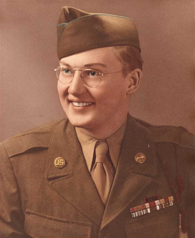 A headshot of a young Ambassador Hugh Montgomery in uniform.