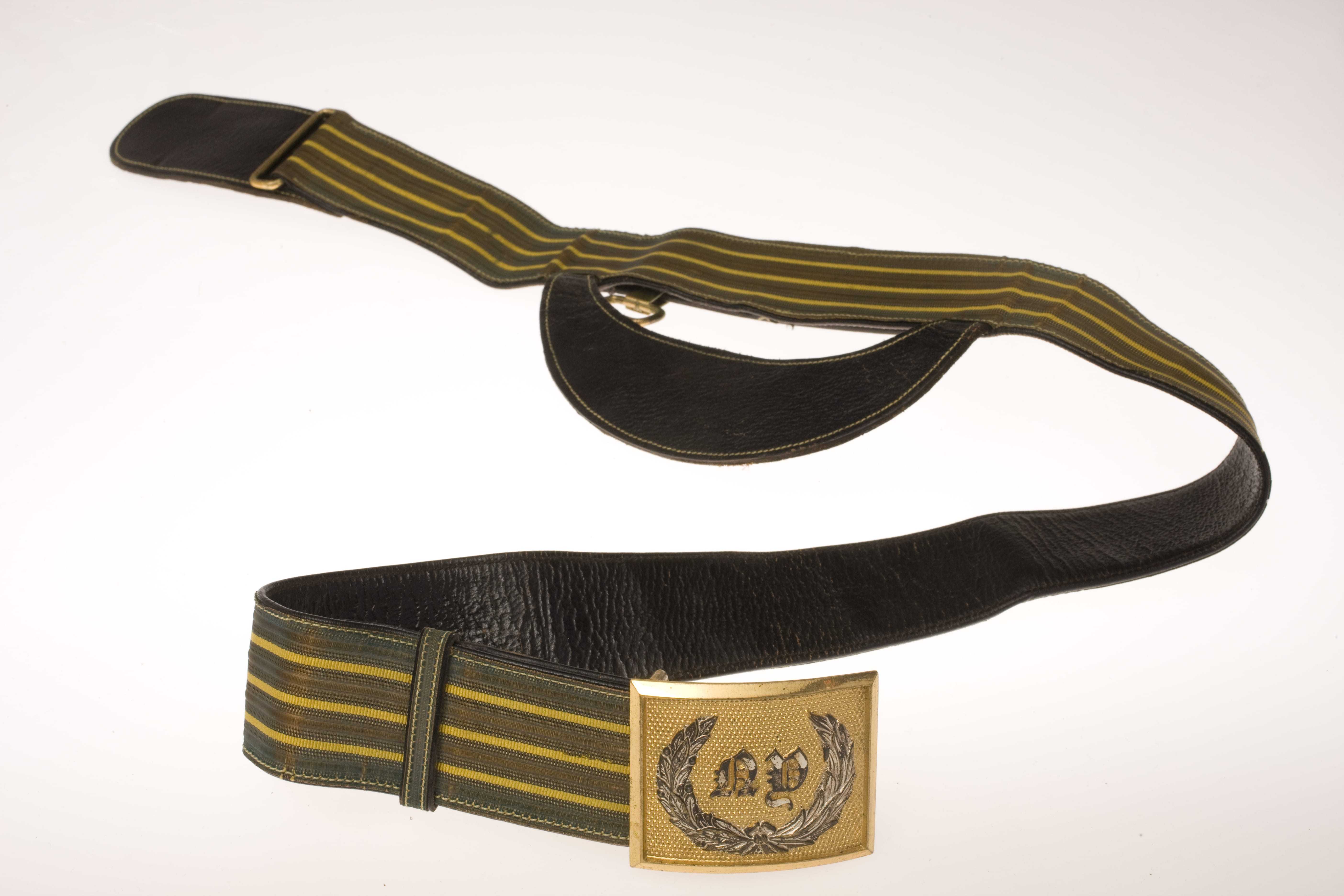 A yellow and black striped belt with "NY" and a laurel wreath on the buckle