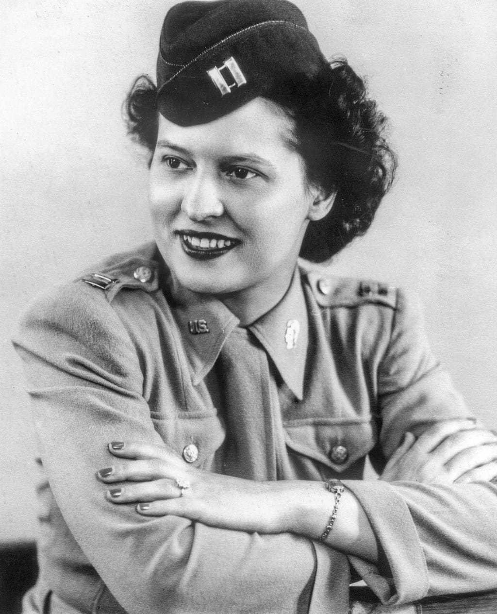 A black and white headshot of Stephanie in uniform.