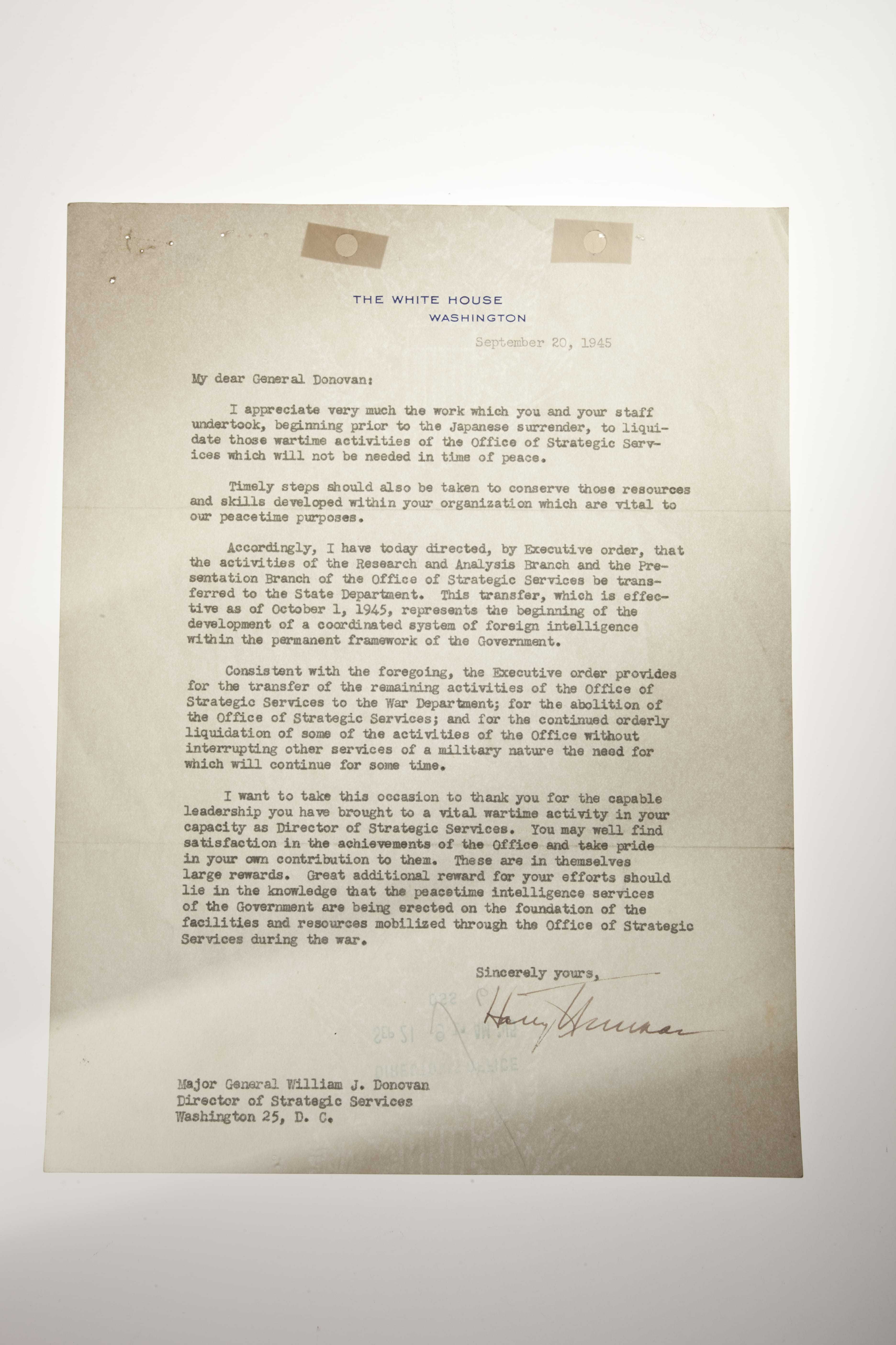 A letter signed by President Truman ordering the OSS to be dissolved.