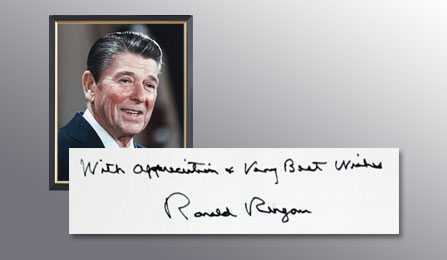 A picture of President Reagan and a handwritten note from him thanking the CIA for their services.