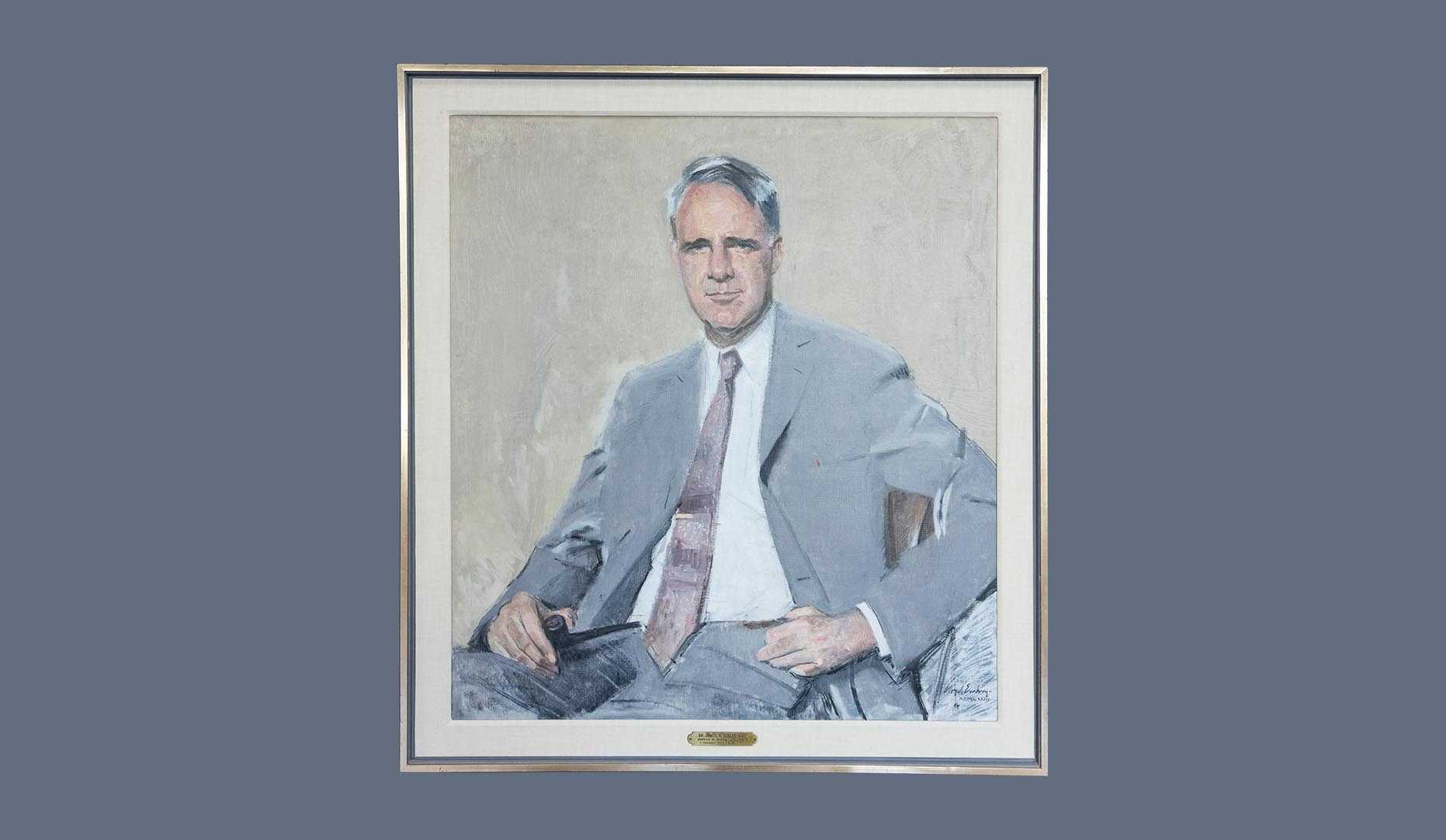 A portrait of former CIA director James R. Schlesinger in a gold frame.