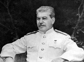 Image of Joseph Stalin sitting in a chair.