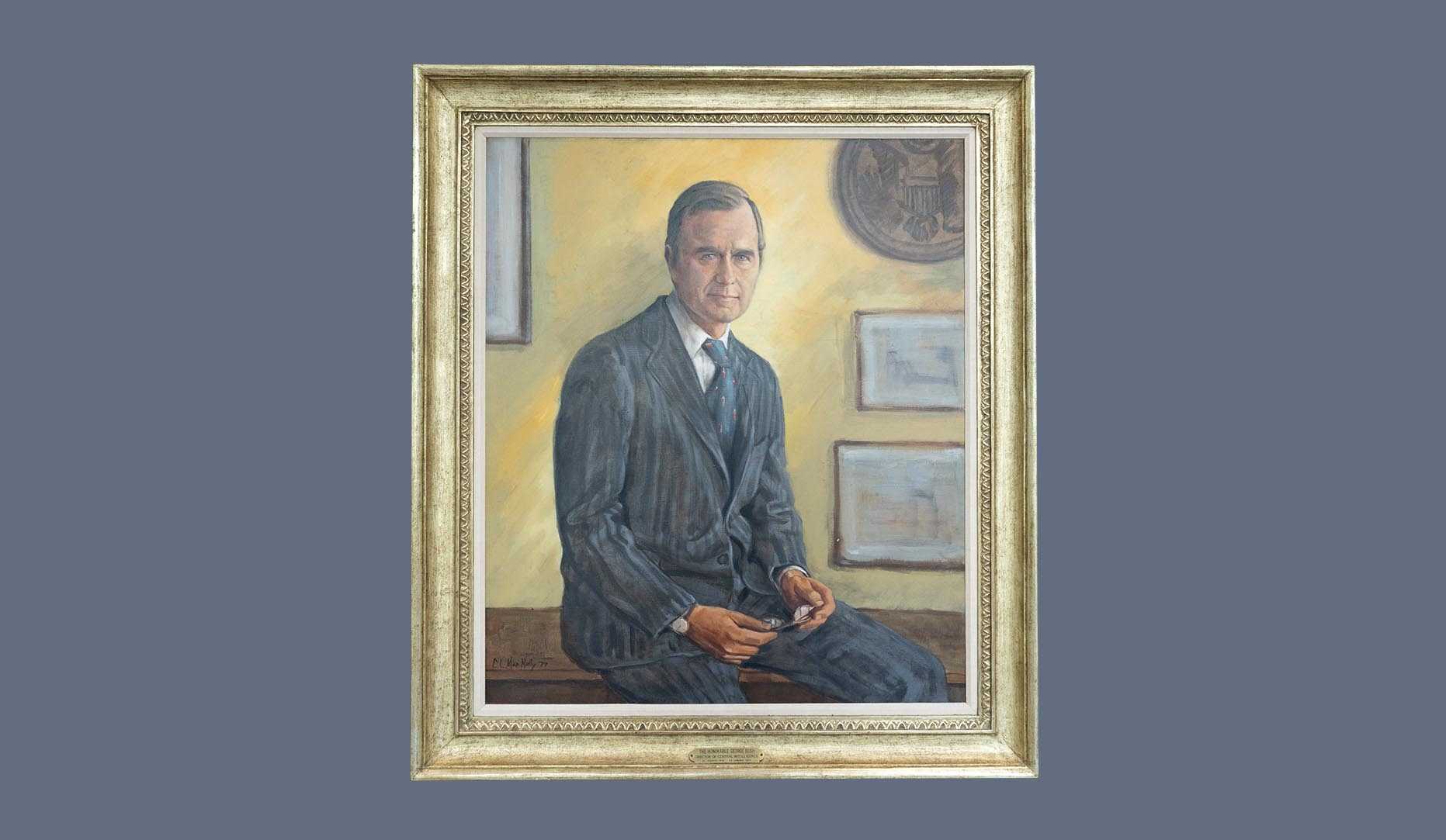 A portrait of former CIA director George H. W. Bush in a gold frame.