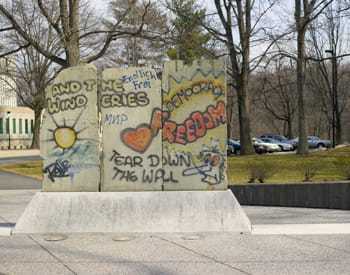 A segment of the Berlin Wall on display at a park.