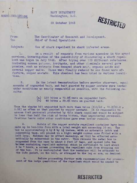 A photograph of a document with "RESTRICTED" stamped on the top and bottom.