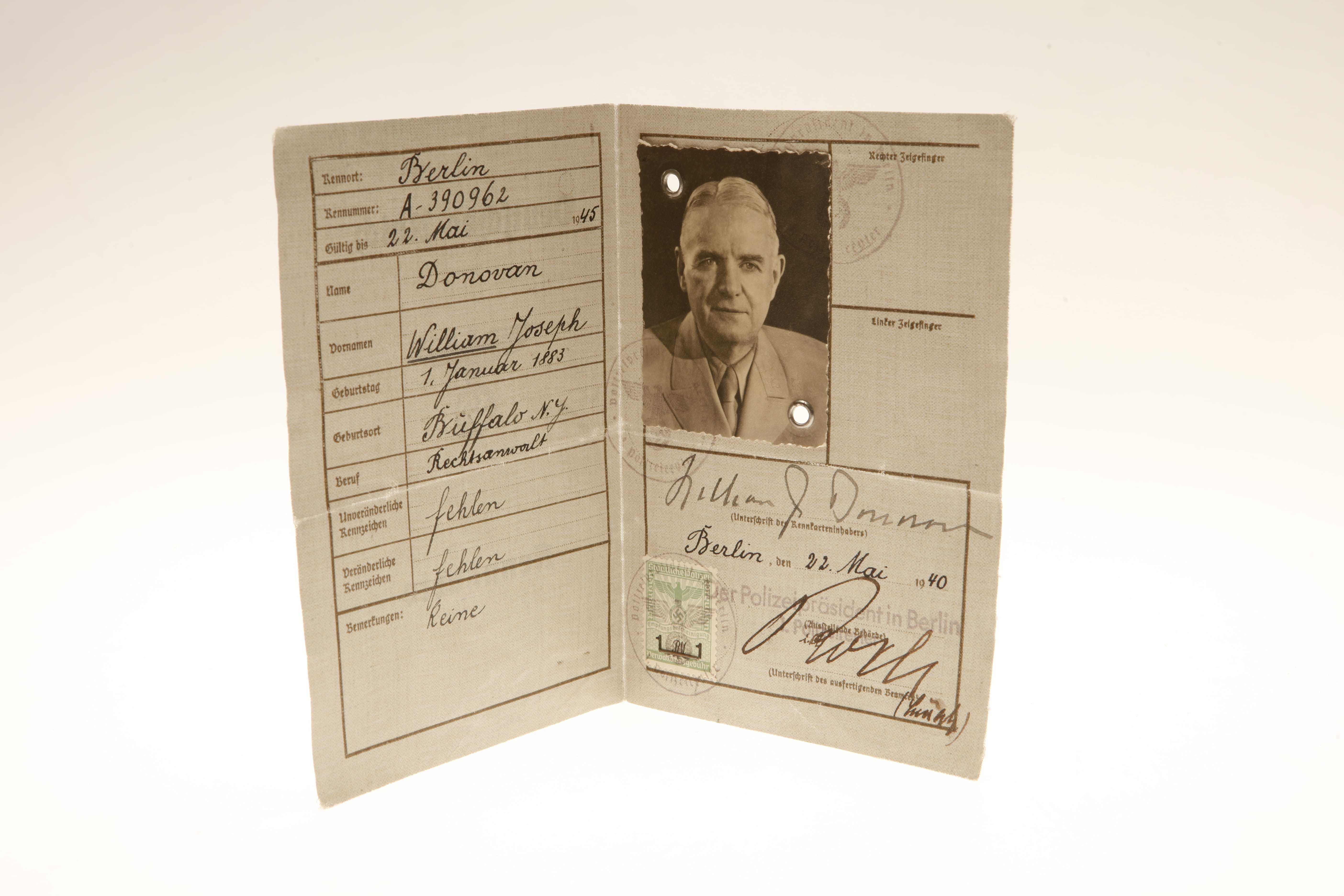 A German ID booklet with the personal details of William J Donovan, his picture, and his signature