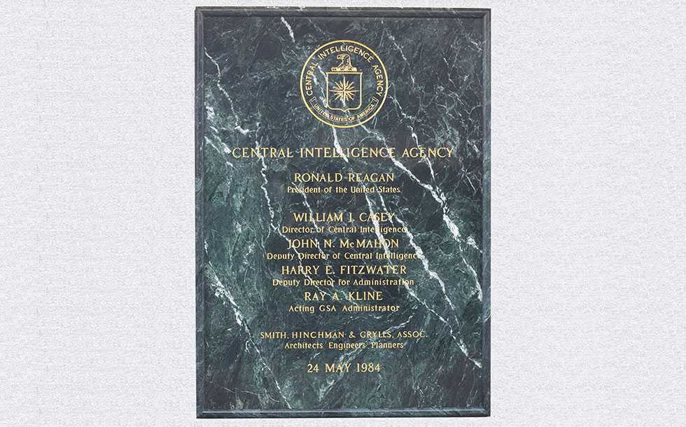 A marbled plaque with the CIA seal and the names of persons who participated in the New Headquarters Building Cornerstone Ceremony engraved on it.