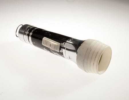 A white plastic flashlight.