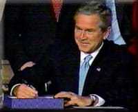 President George W. Bush signing the Intelligence Reform and Terrorism Prevention Act.