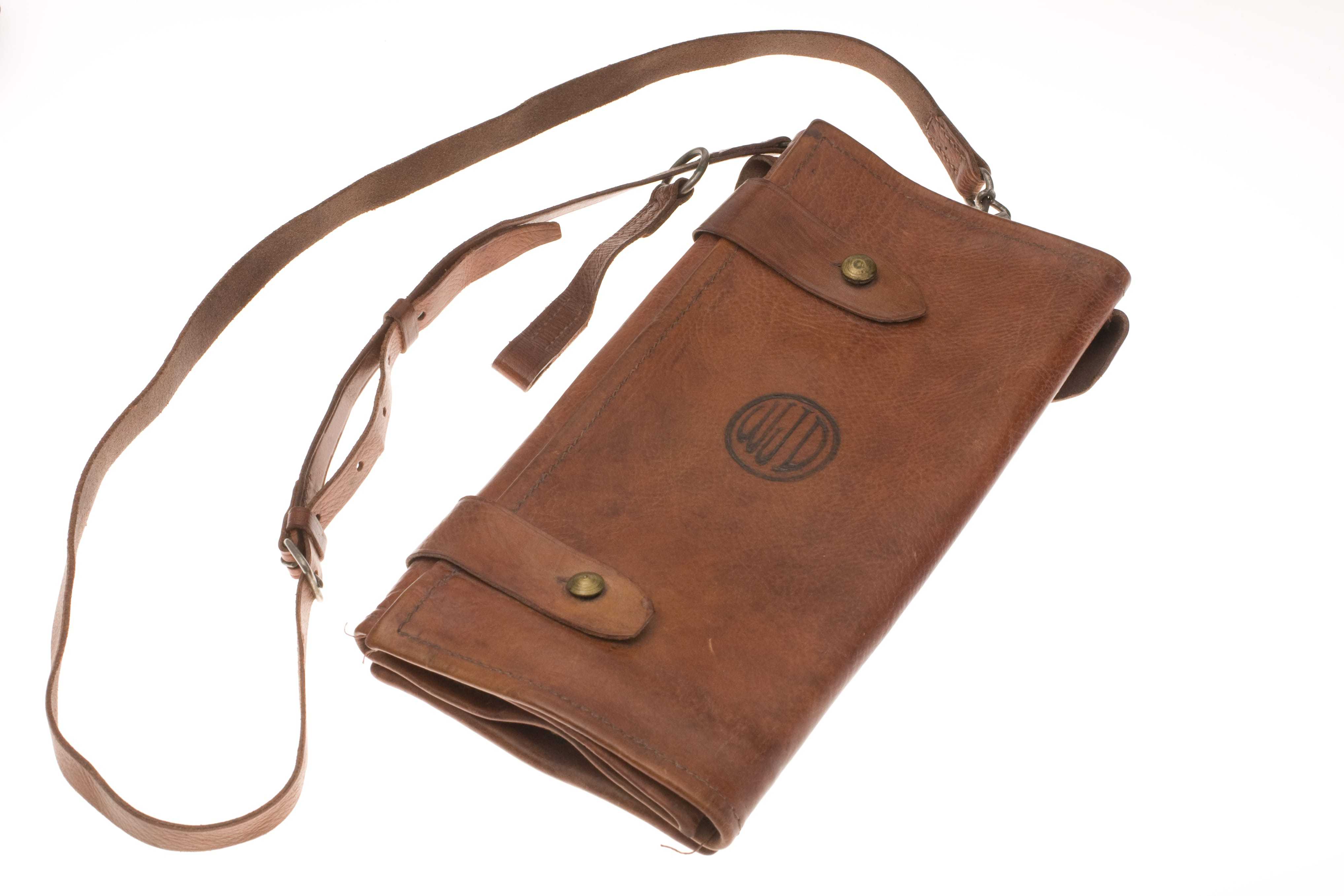 A brown leather shoulder bag with William J