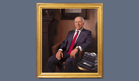 A portrait of former CIA director John O. Brennan in a gold frame.