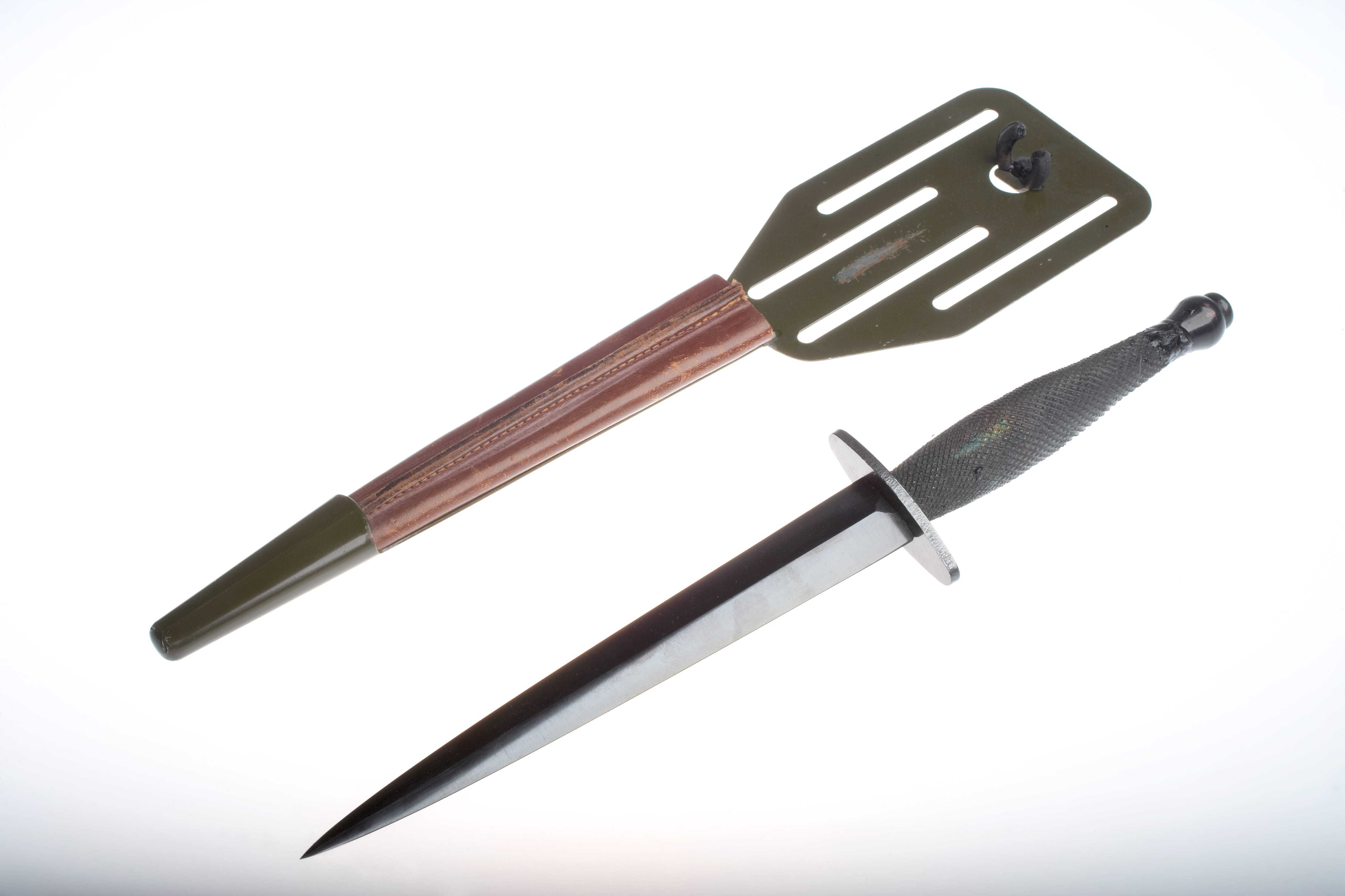 A short silver knife, alongside a wooden sheath