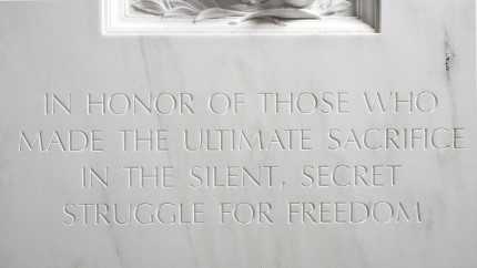 The words "In honor of those who made the ultimate sacrifice in the silent, secret struggle for freedom" engraved in the wall.