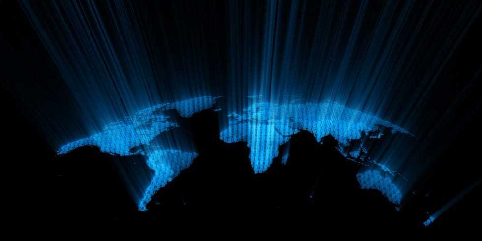 A digital image of the surface of the earth exuding blue lights.