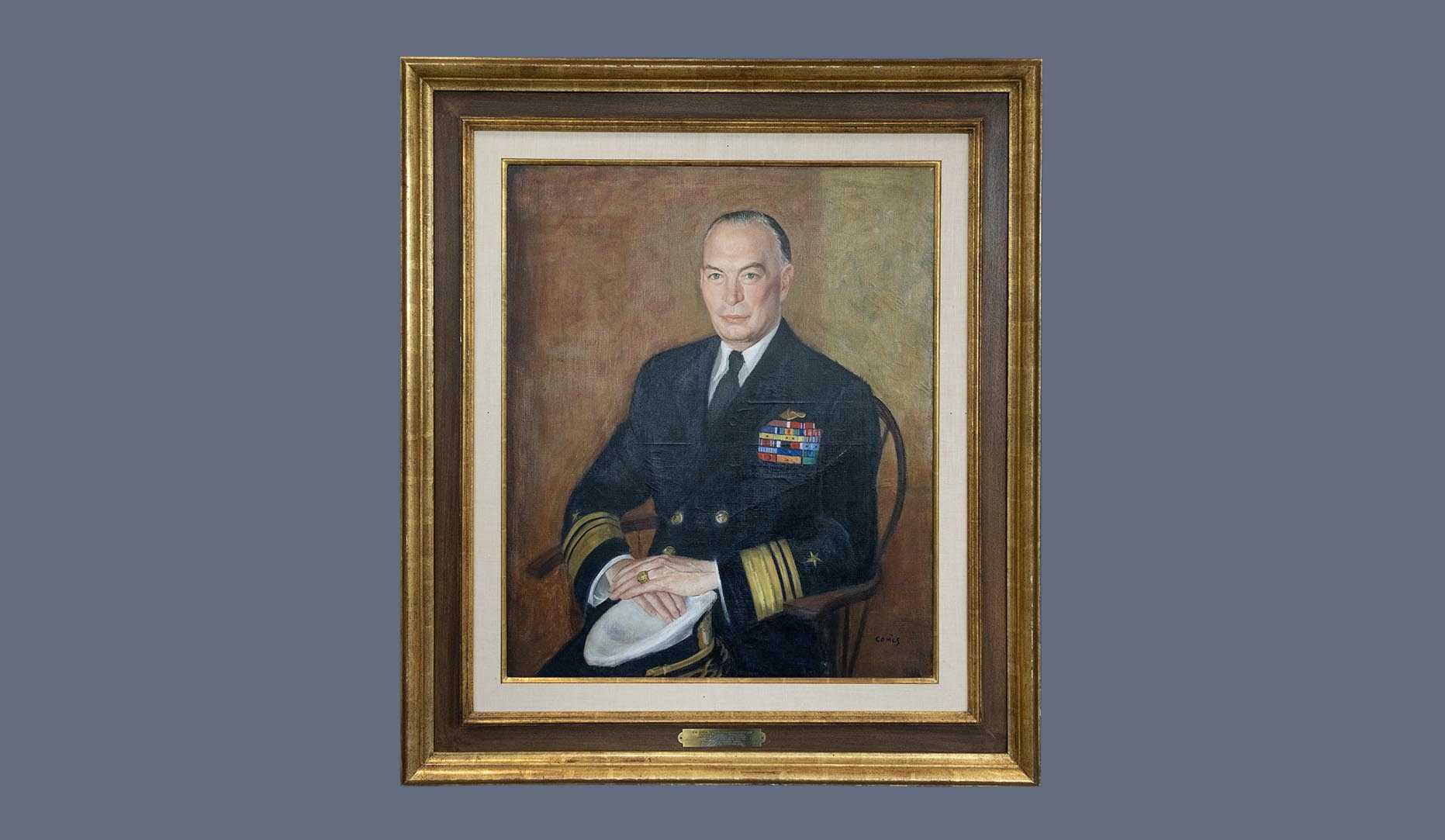 A portrait of former CIA director Roscoe H. Hillenkoetter in a gold frame.