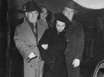 Image of Judith Coplon being arrested for espionage.