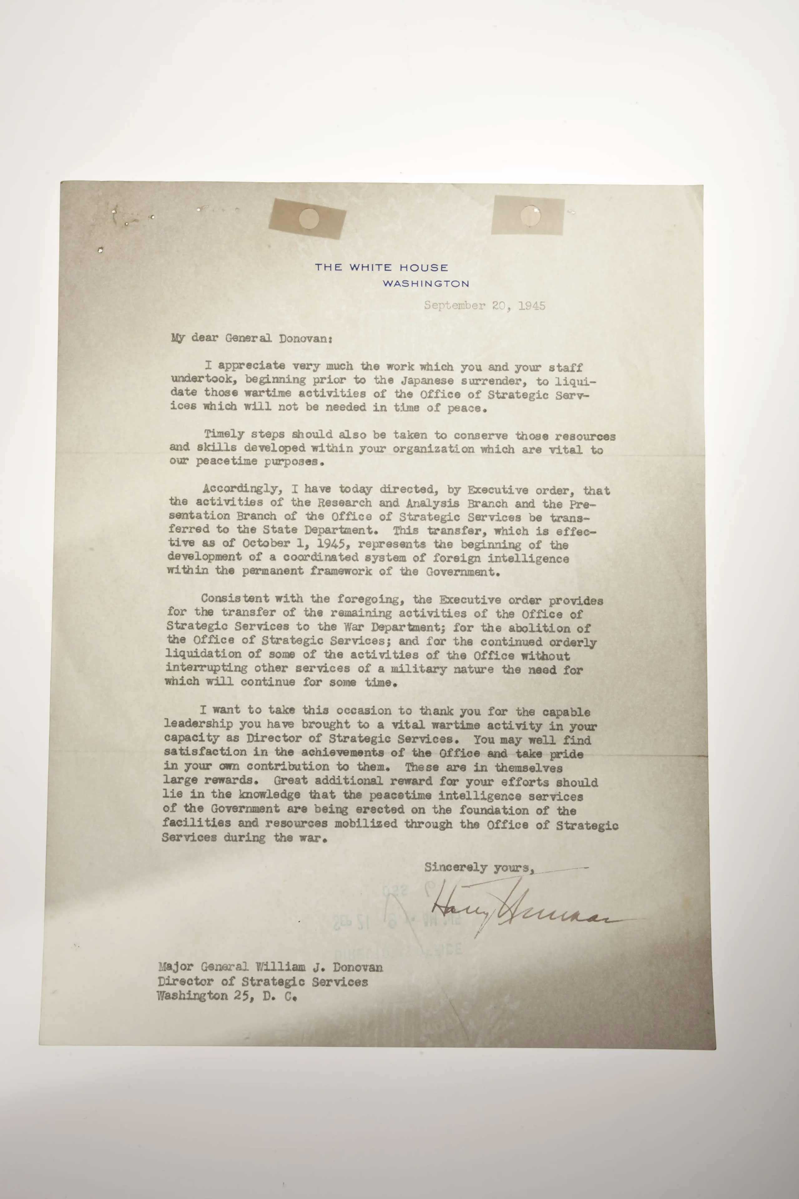 A letter signed by President Truman ordering the OSS to be dissolved.