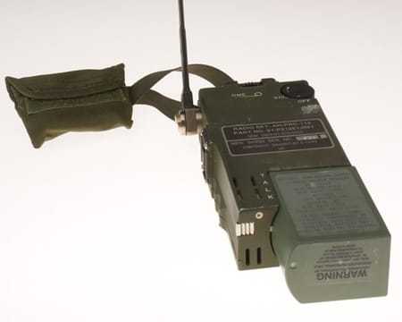 A close up shot of a small green hand held radio
