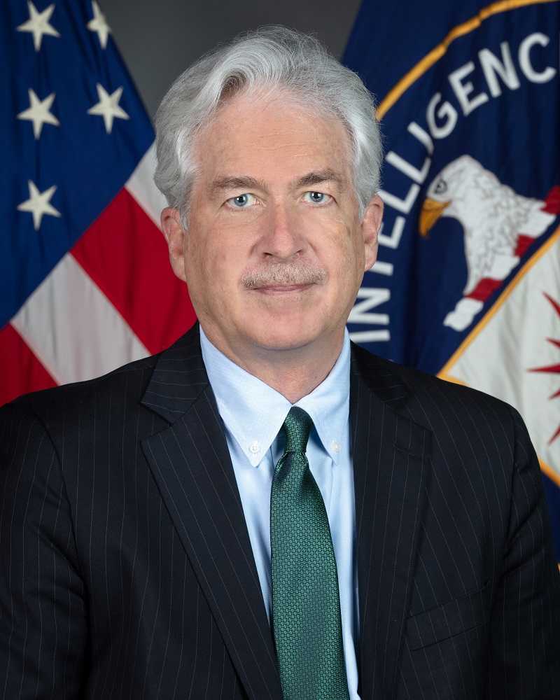 DCIA William Burns portrait with both American and CIA flags in background.