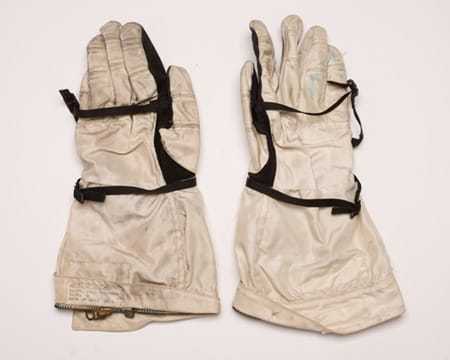 A pair of heavy duty white and black gloves