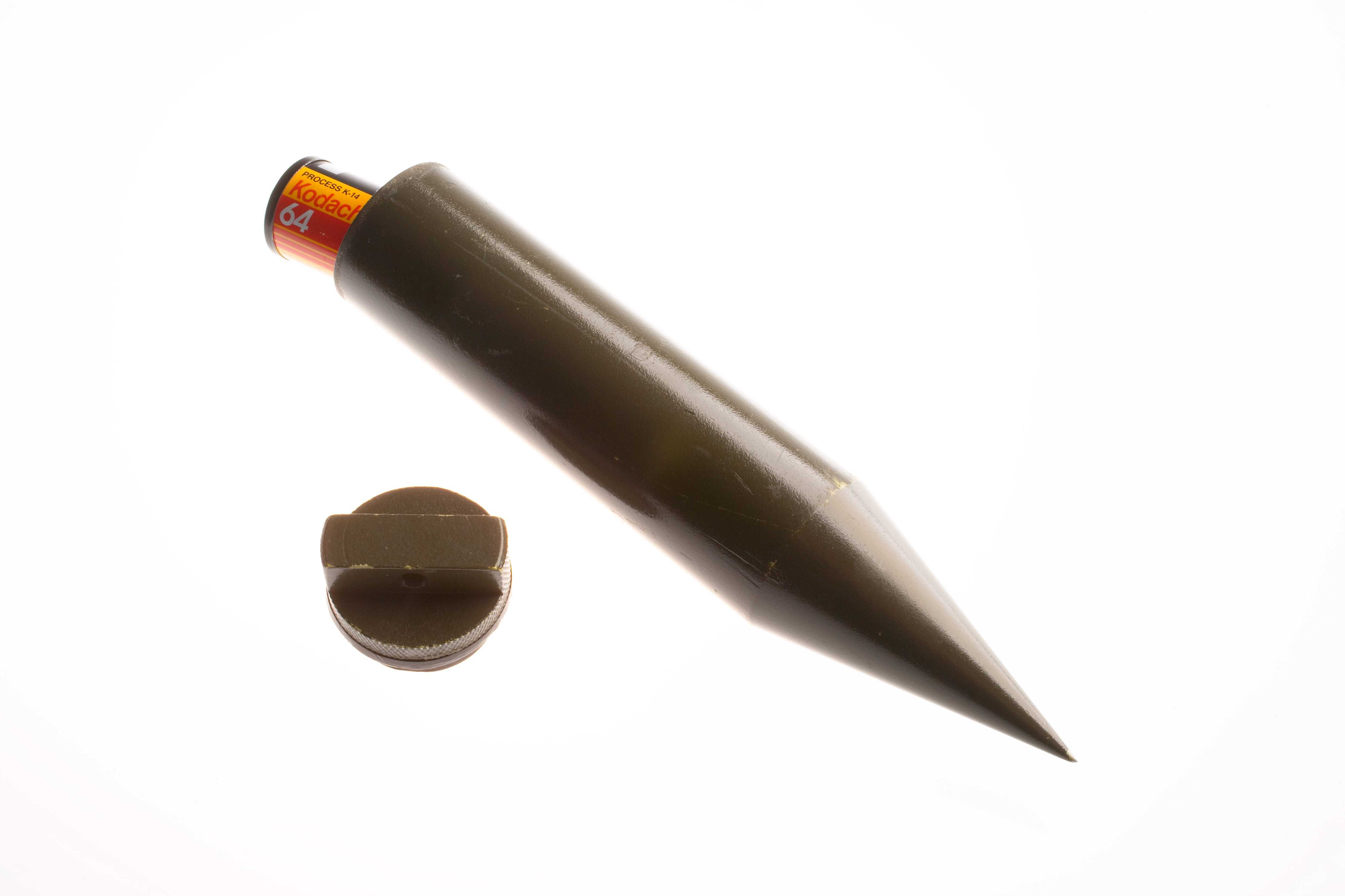 A small brown hollow spike that can contain messages, documents, or film