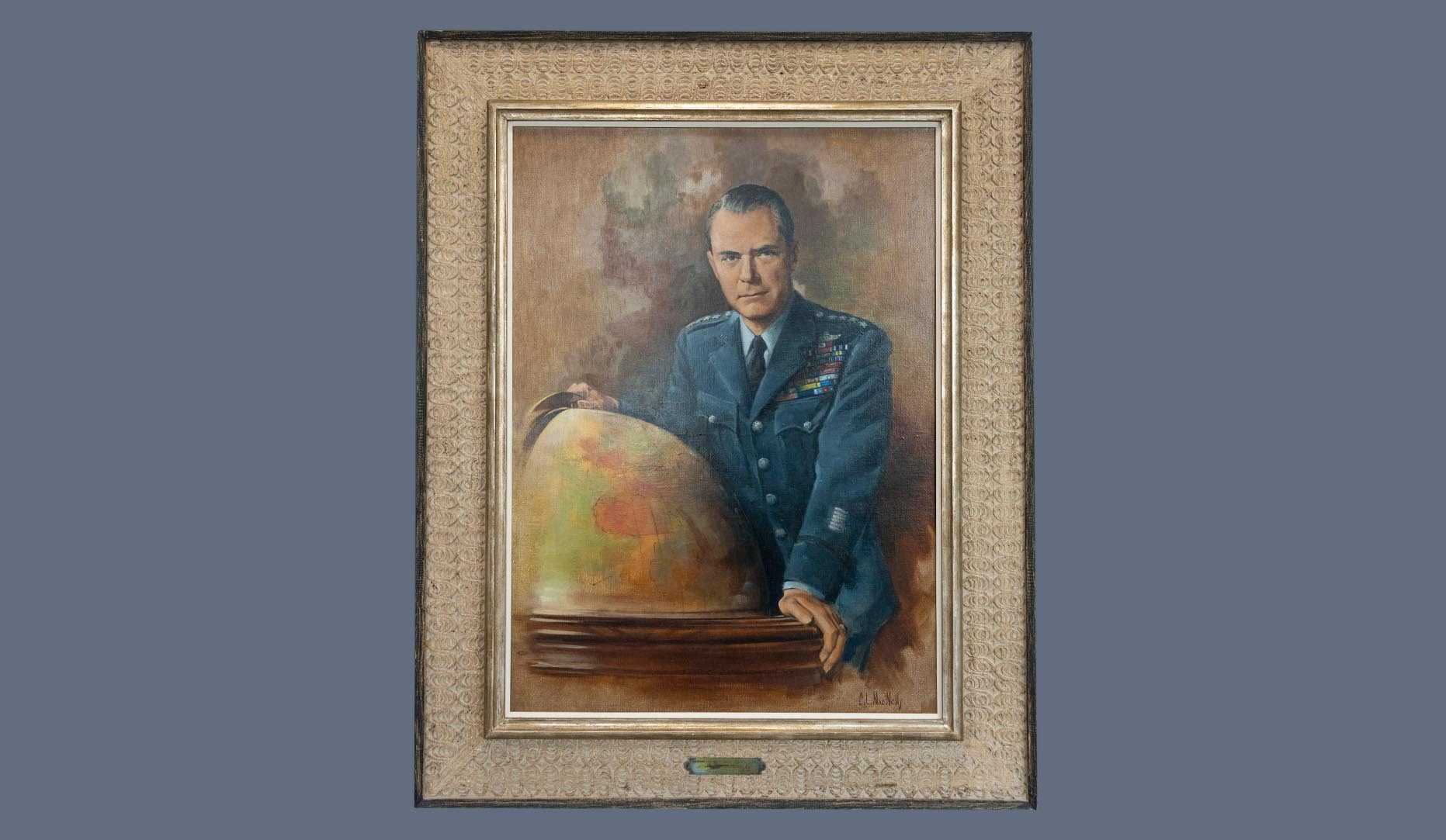 A portrait of former CIA director Hoyt. S. Vandenberg in a gold frame.