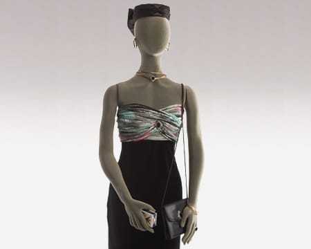 A well dressed female mannequin with a variety of concealed surveillance devices hidden on its person