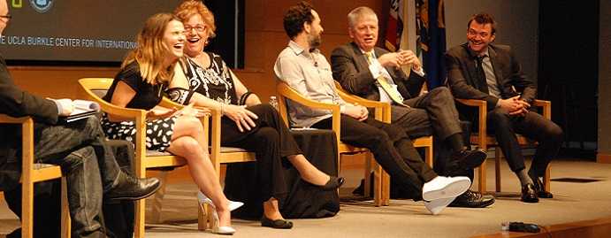 Candid image of former CIA Officers on stage.
