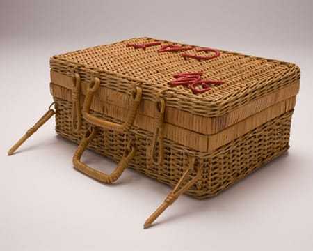 A side view of the wicker basket with several handles