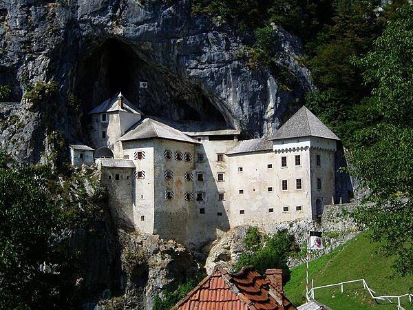 Predjama Castle in Slovenia, a large fortress built into a huge hillside cave.