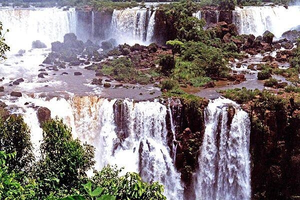 A panoramic view of Iguazu Falls along the Brazil-Argentina border. The entire waterfall system consists of some 275 falls along 2.7 km (1.7 mi) of the Iguazu River.