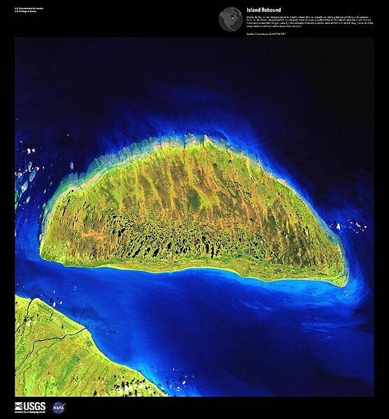 During the last ice age, Akimiski Island in the James Bay lay beneath vast glaciers that pressed down with immense force. As the climate changed and the ice retreated, Akimiski began a gradual rebound. The island&apos;s slow but steady increase in elevation is recorded along its naturally terraced edges in this false-color satellite image where the coastline seems etched with bathtub rings, the result of the rising landmass and wave action at previous sea levels. Image courtesy of USGS.