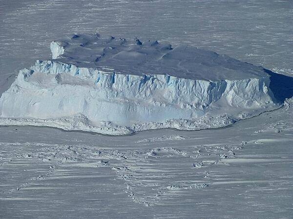 An iceberg trapped in sea ice in the Amundsen Sea, as seen from NASA&apos;s IceBridge DC-8 during a mission on 27 October 2012. Credit: NASA/Maria-Jose Vinas.