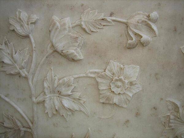 Realistic bas-relief floral design in marble at the Taj Mahal.