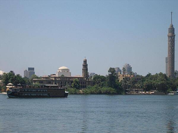 Cruising through Cairo on the Nile. The 187 m high Cairo Tower (concrete TV tower) on the far right is 48 m higher than the Great Pyramid at Giza.