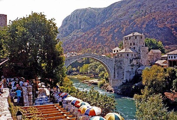 The famous Stari Most (Old Bridge) in Mostar connects the two parts of the city divided by the Neretva River. Built during the 16th century under Suleiman the Magnificent, the bridge was destroyed in 1993 during the Bosnian War, but was subsequently rebuilt and reopened in 2004.
