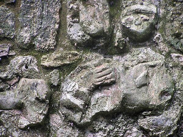 Traces of red paint still visible on a Maya carving at Chacchoben, Quintana Roo.