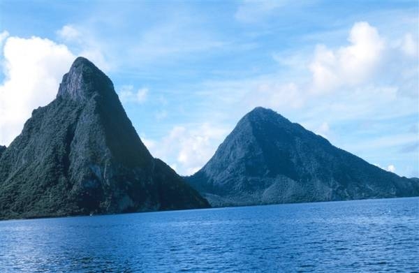 The distinctive Twin Pitons - seen here from the sea - are the national symbol of Saint Lucia. Photo courtesy of NOAA / Anthony R. Picciolo.