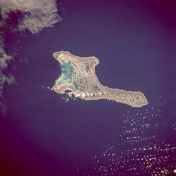 Kiritimati Island (formerly Christmas Island), the largest atoll in the Pacific Ocean, is the centerpiece of this low-oblique, northeast-looking photo. The atoll covers 606 sq km (234 sq mi), of which 243 sq km (94 sq mi) are land. The island was discovered by Captain James Cook in 1777. The majority of the island&apos;s inhabitants work on coconut plantations and in copra production. The island&apos;s major airbase is on the northeast side of the island. Nuclear tests were conducted on Kiritimati Island by the British in 1957 and 1958 and by the United States in 1962. Image courtesy of NASA.