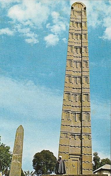 King Ezana's Stela is a 21-m (69-ft) tall obelisk in the ancient city of Axum. The monument, which dates to the 4th century A.D., stands at the center of the Northern Stelae Park along with hundreds of smaller and less decorated stelae. It is decorated with a false door at its base, and apertures resembling windows on all sides. The obelisk’s semi-circular apex used to be enclosed by metal frames. In 2007-08, the stela was structurally consolidated and today is braced to prevent its leaning any further.