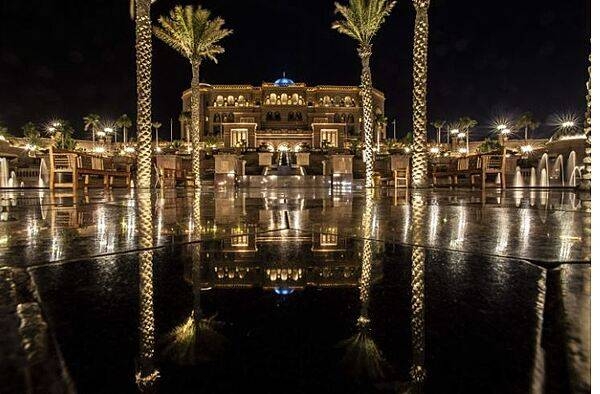 The Emirates Palace is a luxury hotel in Abu Dhabi. Built between 2001 and 2005, the hotel displays a mix of Islamic architectural elements complemented by modern design and construction. The central dome features elaborate geometrical patterns. The color of the building was inspired by different shades of sand in the Arabian Desert. The hotel hosts a 1.2-km long beach.